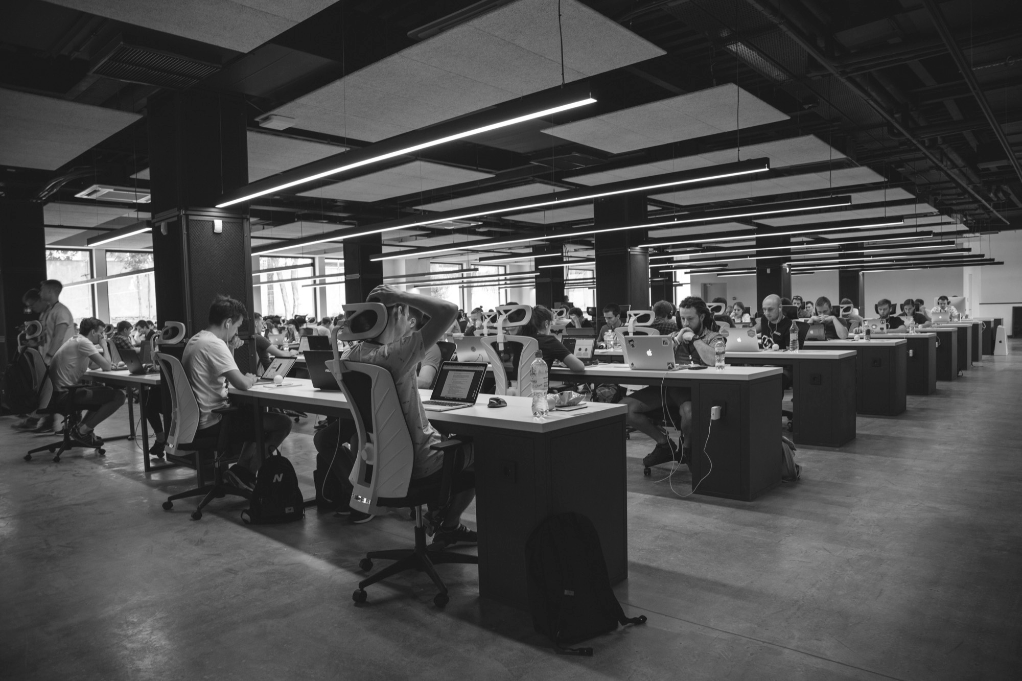 An open plan office, rows of desks